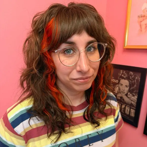 Curly cut with red streak